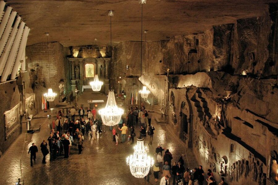 From Krakow: Auschwitz Museum and Wieliczka Salt Mine Tour - Wieliczka Salt Mine: The 380-Step Descent and What You Hear