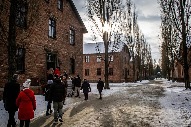 Krakow: Auschwitz-Birkenau Guided Tour with Ticket and Transfer - A long day with transfers, not just a bus ride