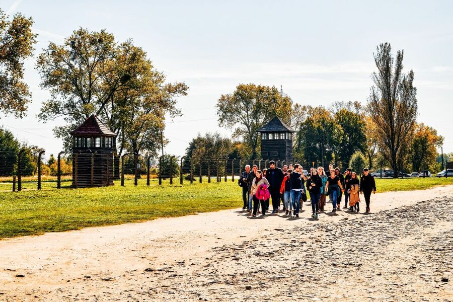 Krakow: Auschwitz-Birkenau Live Guided Tour & Hotel Pickup - Entering Auschwitz I: Main Gate Moments and Block 11