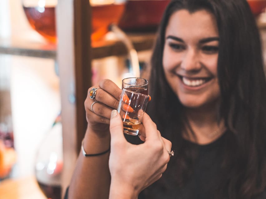 Kraków: Guided Vodka Tour with Food and Drink Tastings - The homemade flavored vodka cafe and the 100+ variety candlelit bar