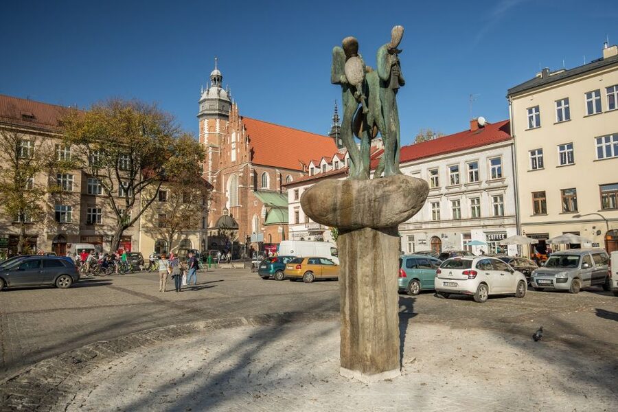 Krakow: Jewish Ghetto Guided Walking Tour - Remnants of the ghetto wall, up close and unsettling