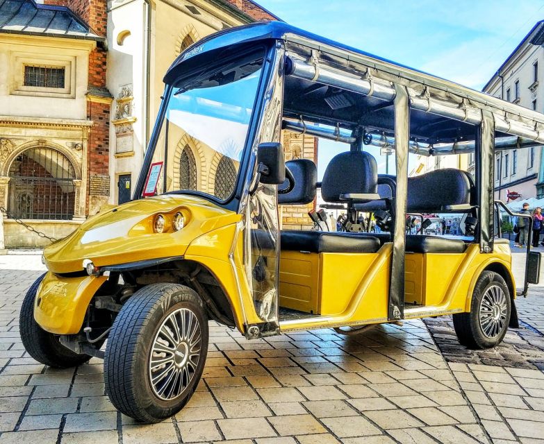 Krakow: Kazimierz by Golf Cart and Schindler's Factory Tour - Podgórze and the former ghetto area: seeing the wall fragment and Heroes Square