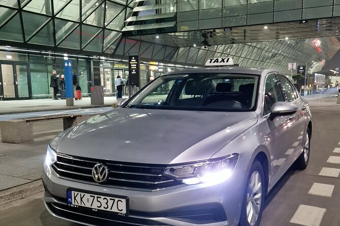 Private Taxi from or to the Krakow Airport - Finding your driver: arrivals hall, name sign, and the 1-hour wait