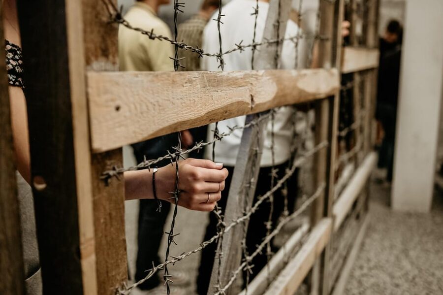 Schindler's Factory Museum in Krakow - Guided Tour - Languages and group reality inside dim, narrow rooms